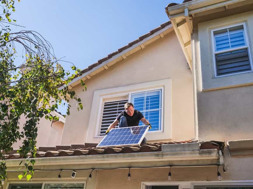 A photo of a person inspecting the roof for potential leaks